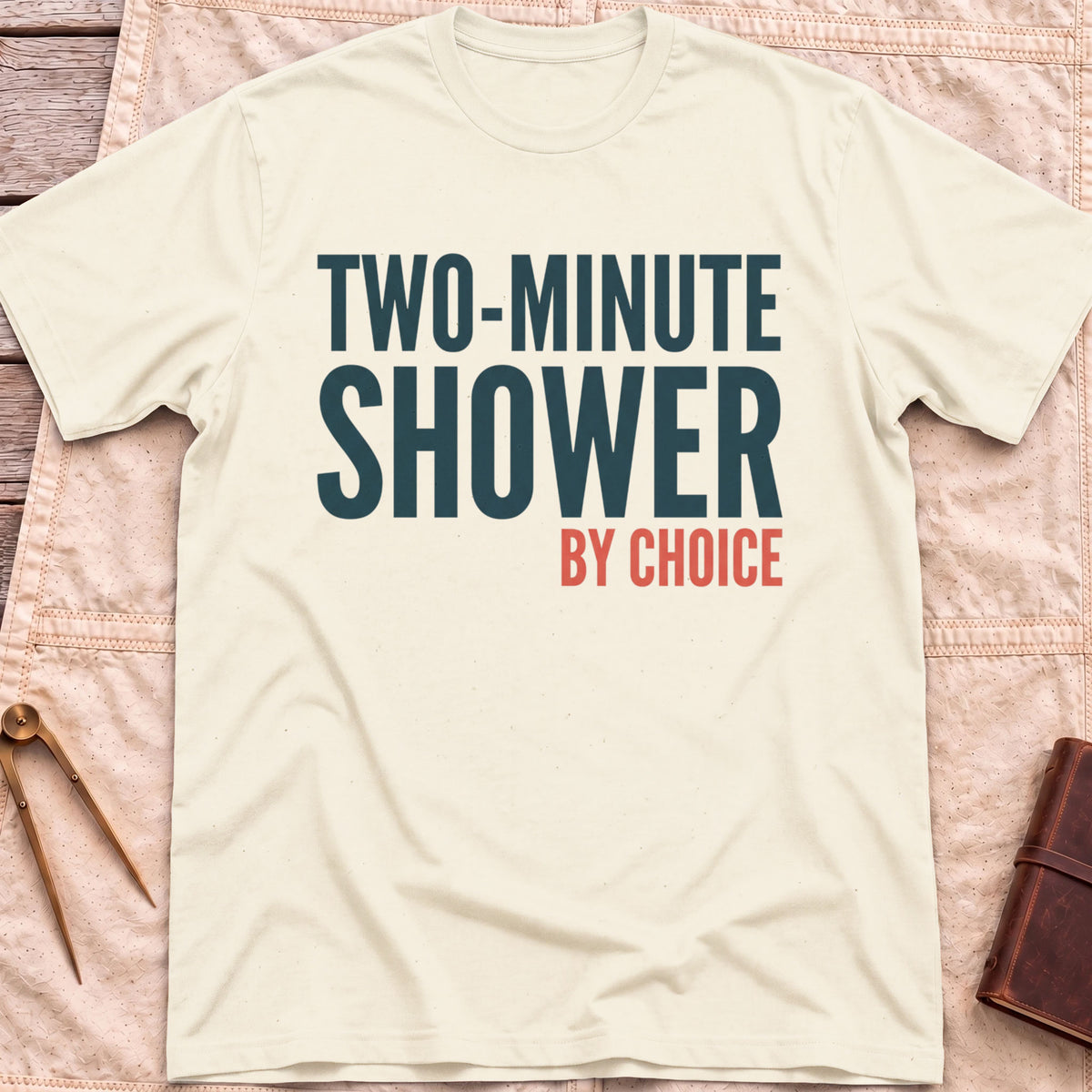 Front view of the natural Two Minute Shower T-Shirt with the words Two-Minute Shower, By Choice in bold lettering.
