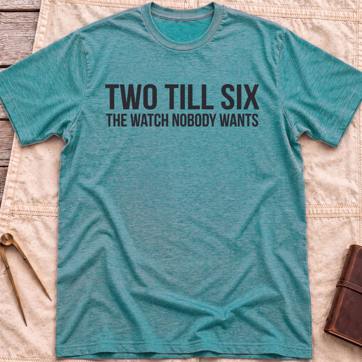 Front view of the heather galapagos blue Two Till Six T-Shirt with the words Two Till Six above The Watch Nobody Wants.