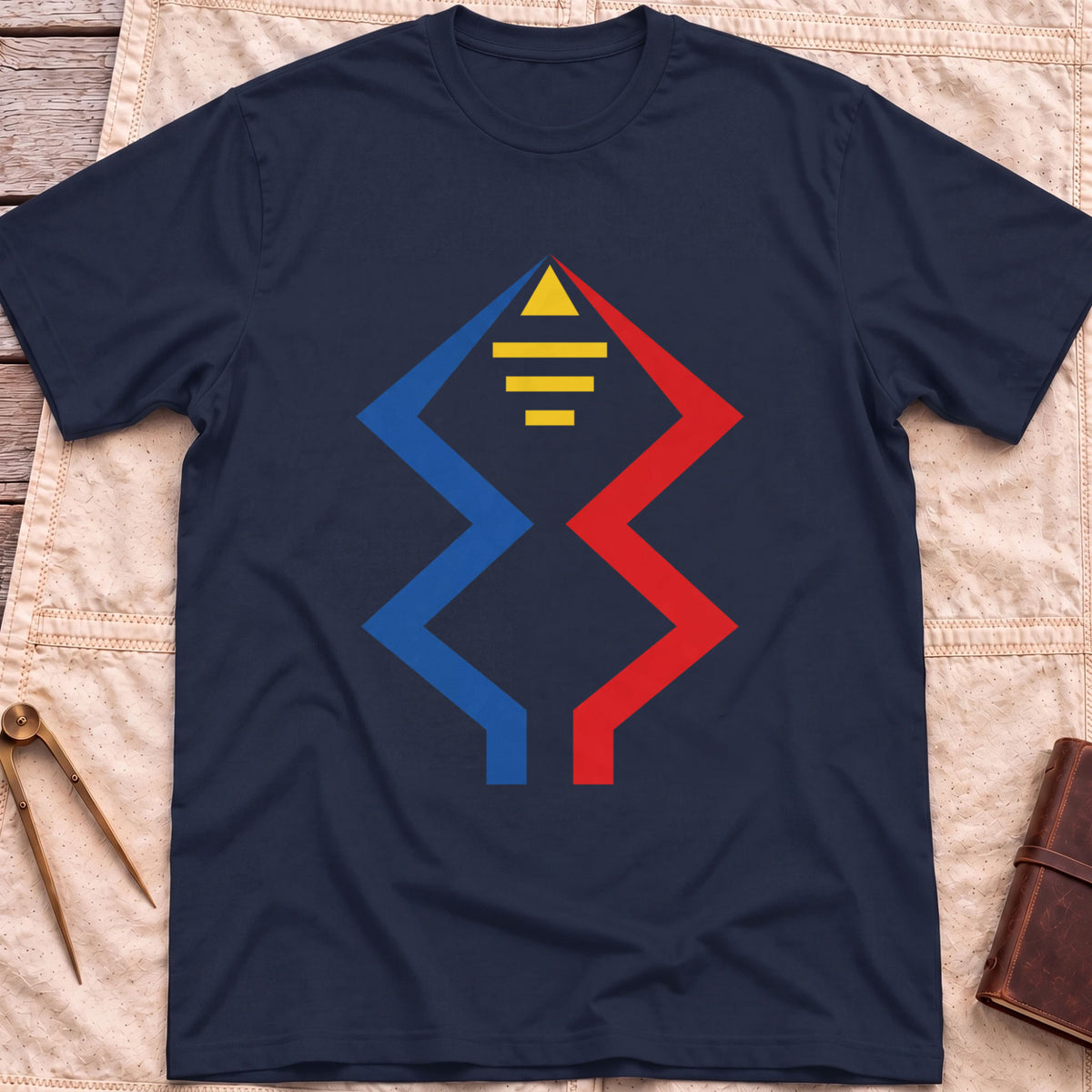 Front view of the navy Windward Mark T-Shirt with blue and red zigzag lines rising to a yellow triangle above short yellow bars.