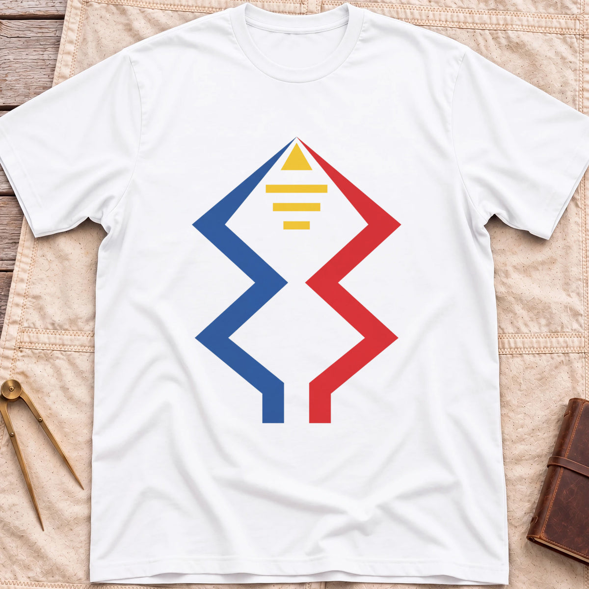 Front view of the white Windward Mark T-Shirt with blue and red zigzag lines rising to a yellow triangle above short yellow bars.