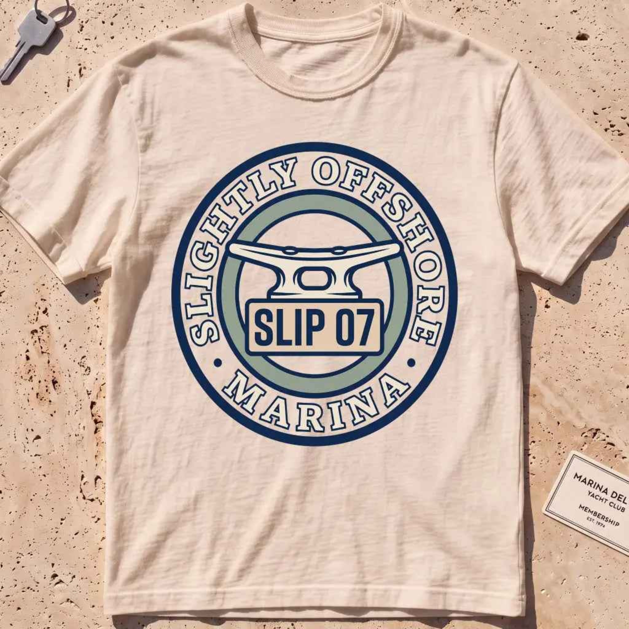 ivory heavyweight tee with a dock cleat and "Slip 07" badge graphic.