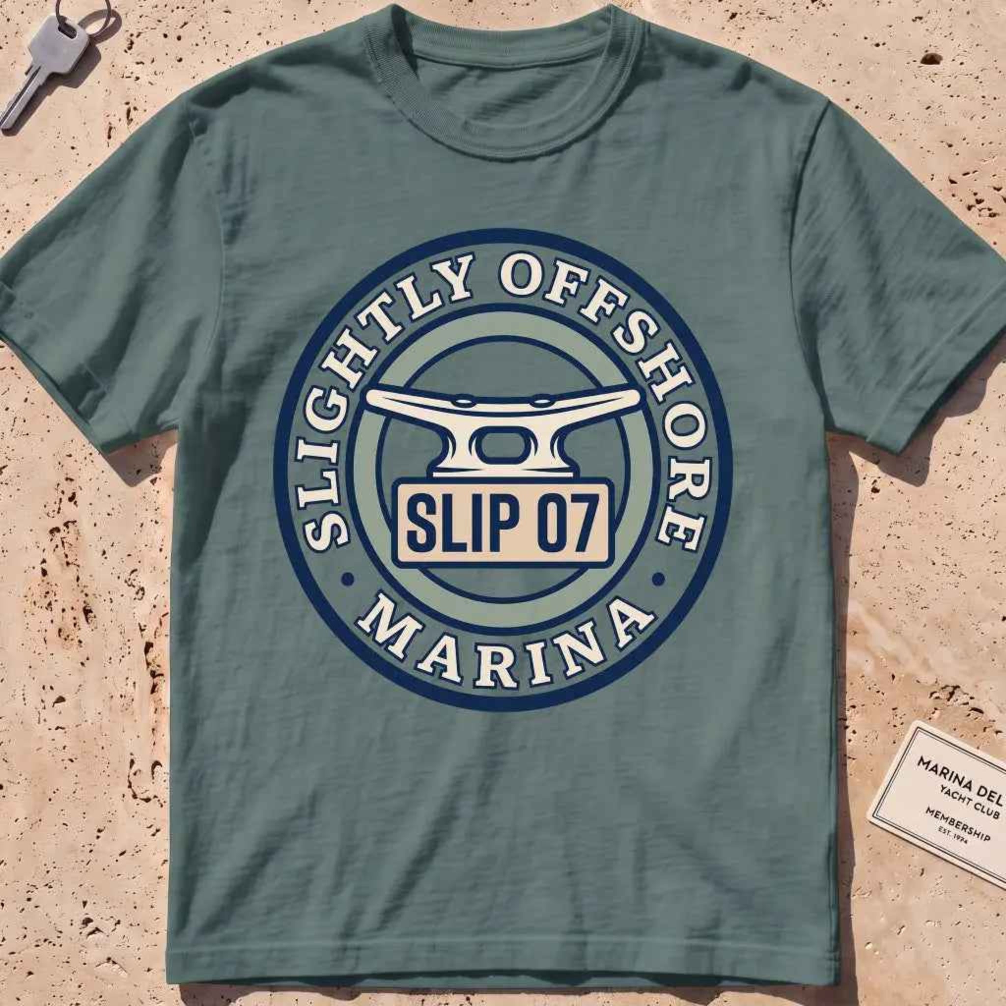 blue spruce heavyweight tee with a dock cleat and "Slip 07" badge graphic.