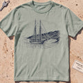 bay heavyweight tee with an etched schooner moored in a cove graphic.