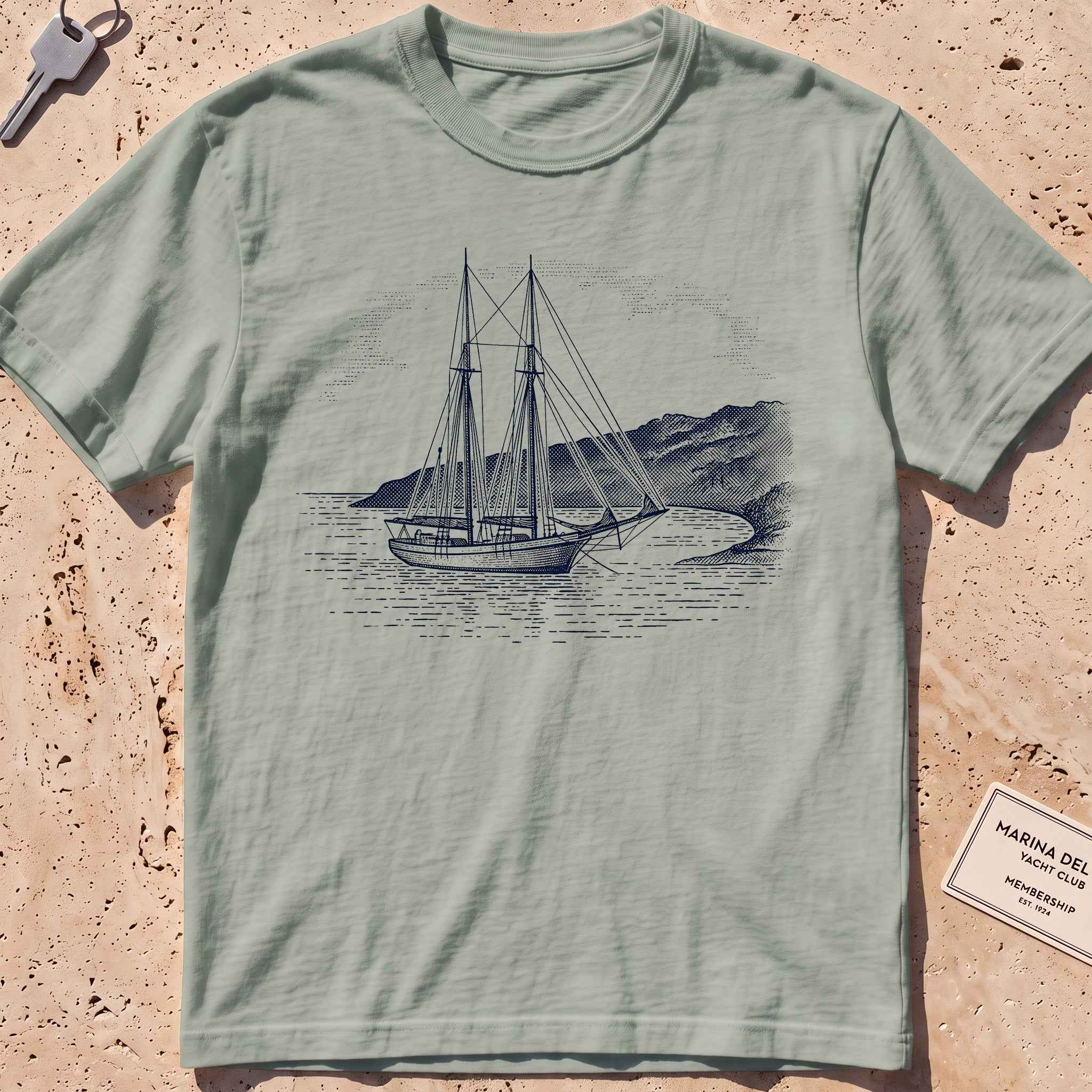 bay heavyweight tee with an etched schooner moored in a cove graphic.