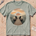 bay heavyweight tee with a warm dock-at-dusk "Someday Is a Place" scene.