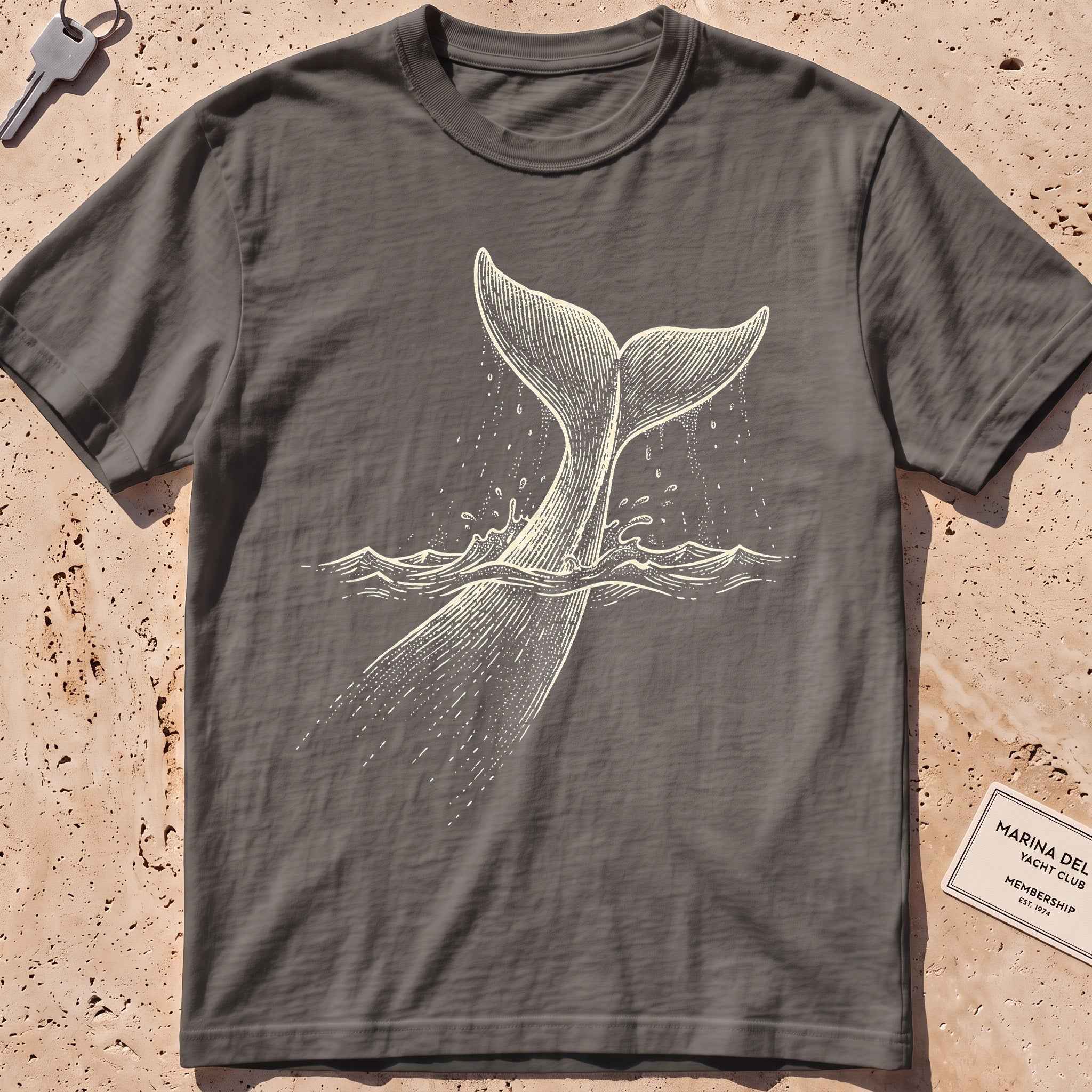 pepper heavyweight tee with an etched sperm whale diving deep graphic.