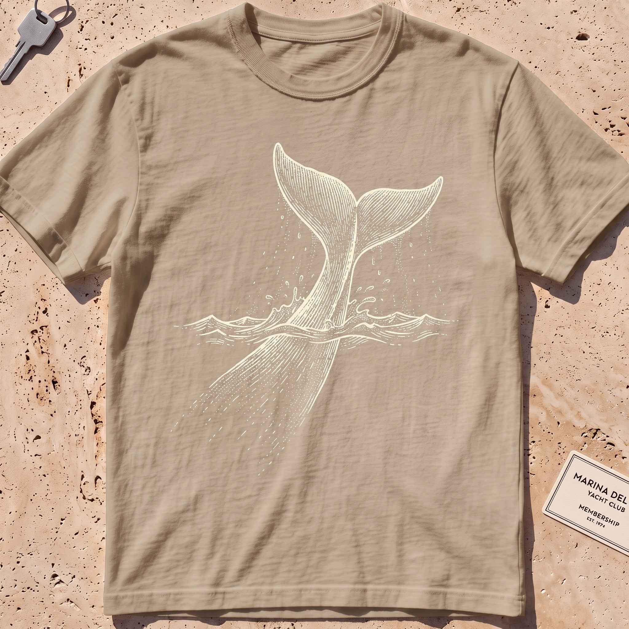 khaki heavyweight tee with an etched sperm whale diving deep graphic.