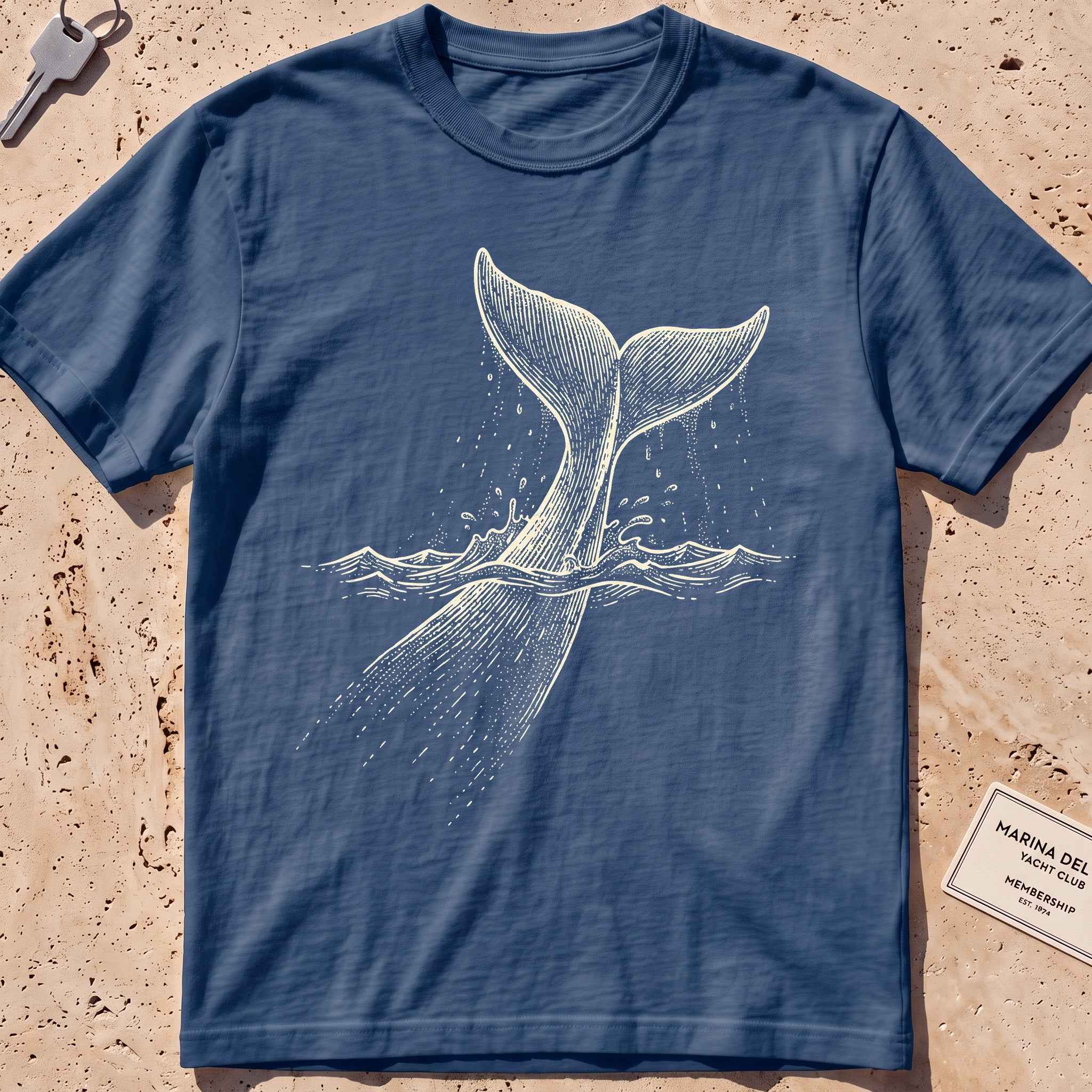 midnight heavyweight tee with an etched sperm whale diving deep graphic.