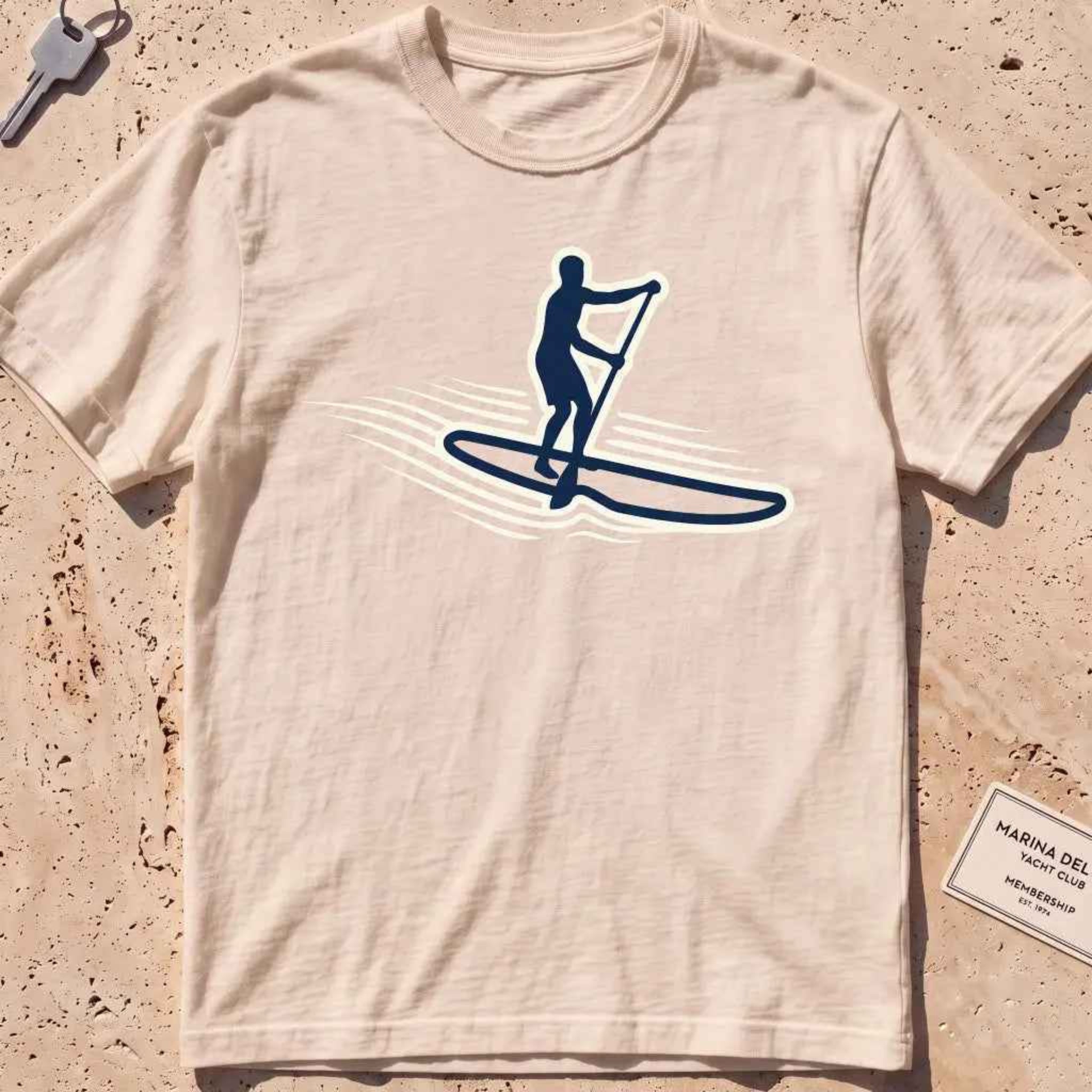 ivory heavyweight tee with a stand-up paddleboarder "Standing Calm" graphic.