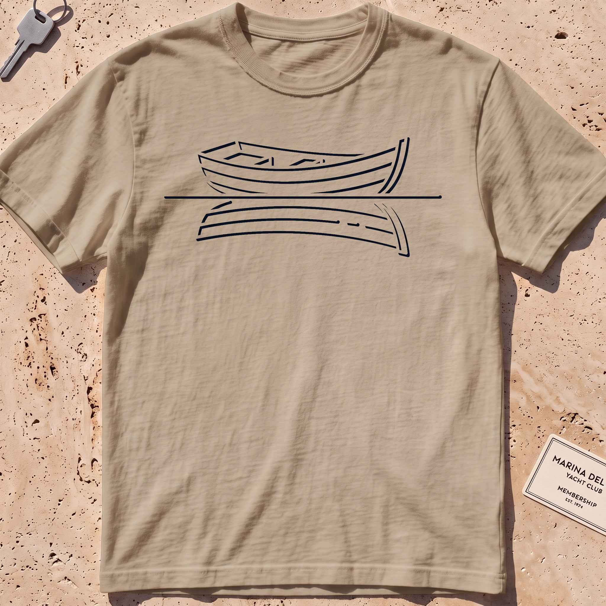 khaki heavyweight tee with a single-line rowboat and still-water reflection.