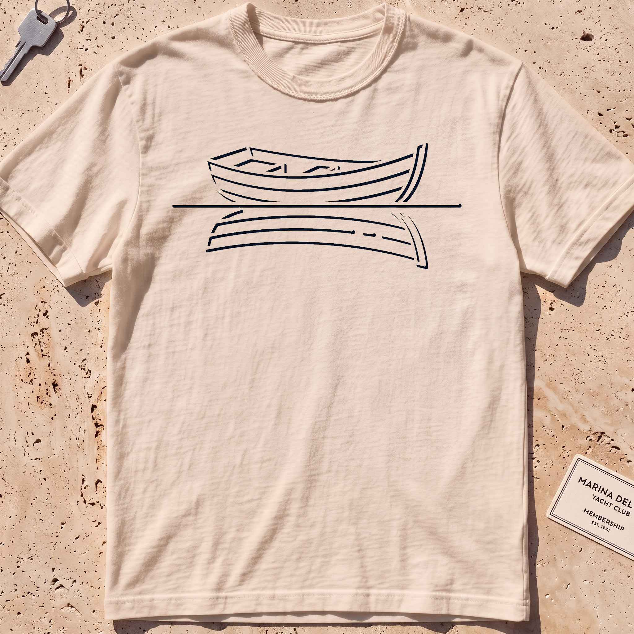 ivory heavyweight tee with a single-line rowboat and still-water reflection.