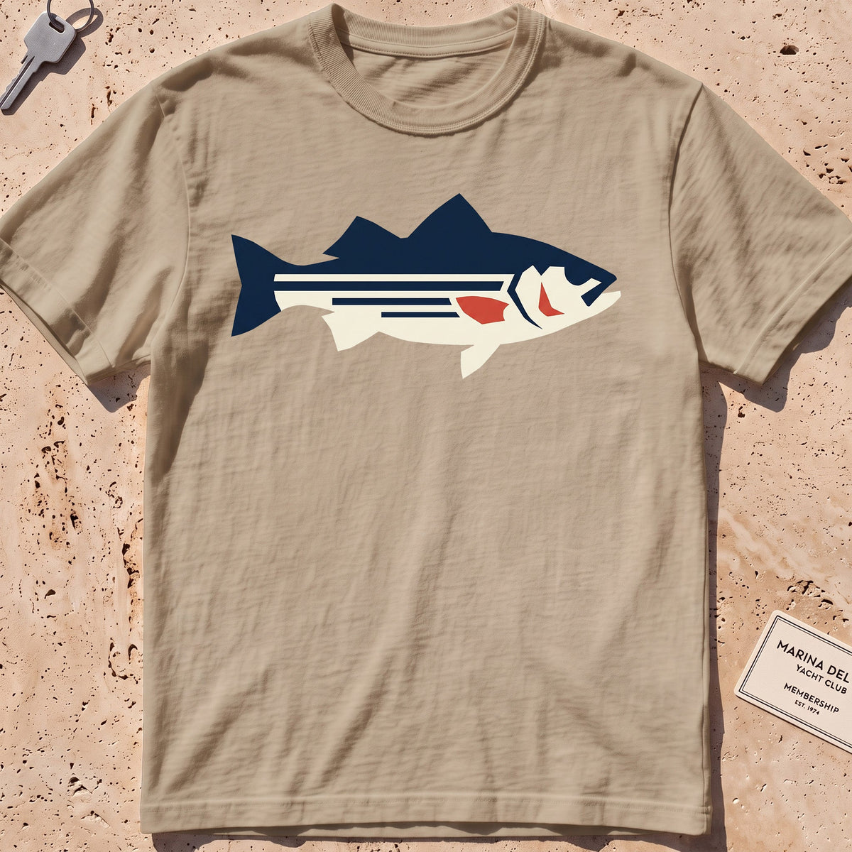 khaki heavyweight tee with a flat-geometric striped bass graphic.