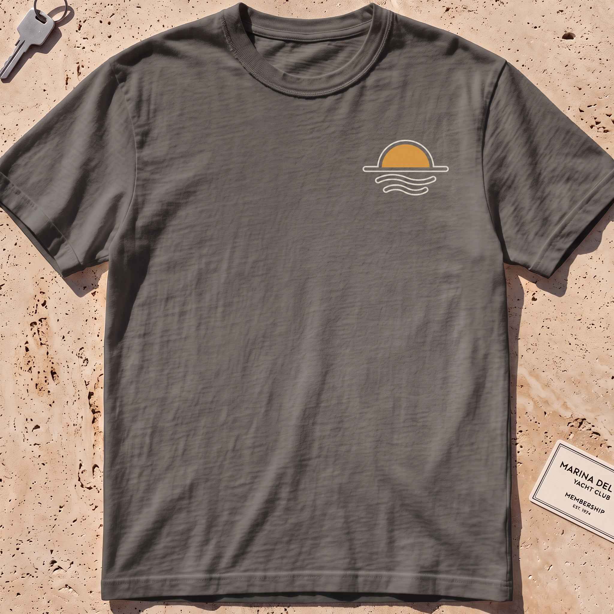 pepper heavyweight tee with a sun-and-waves crest graphic.