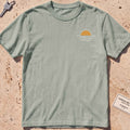 bay heavyweight tee with a sun-and-waves crest graphic.