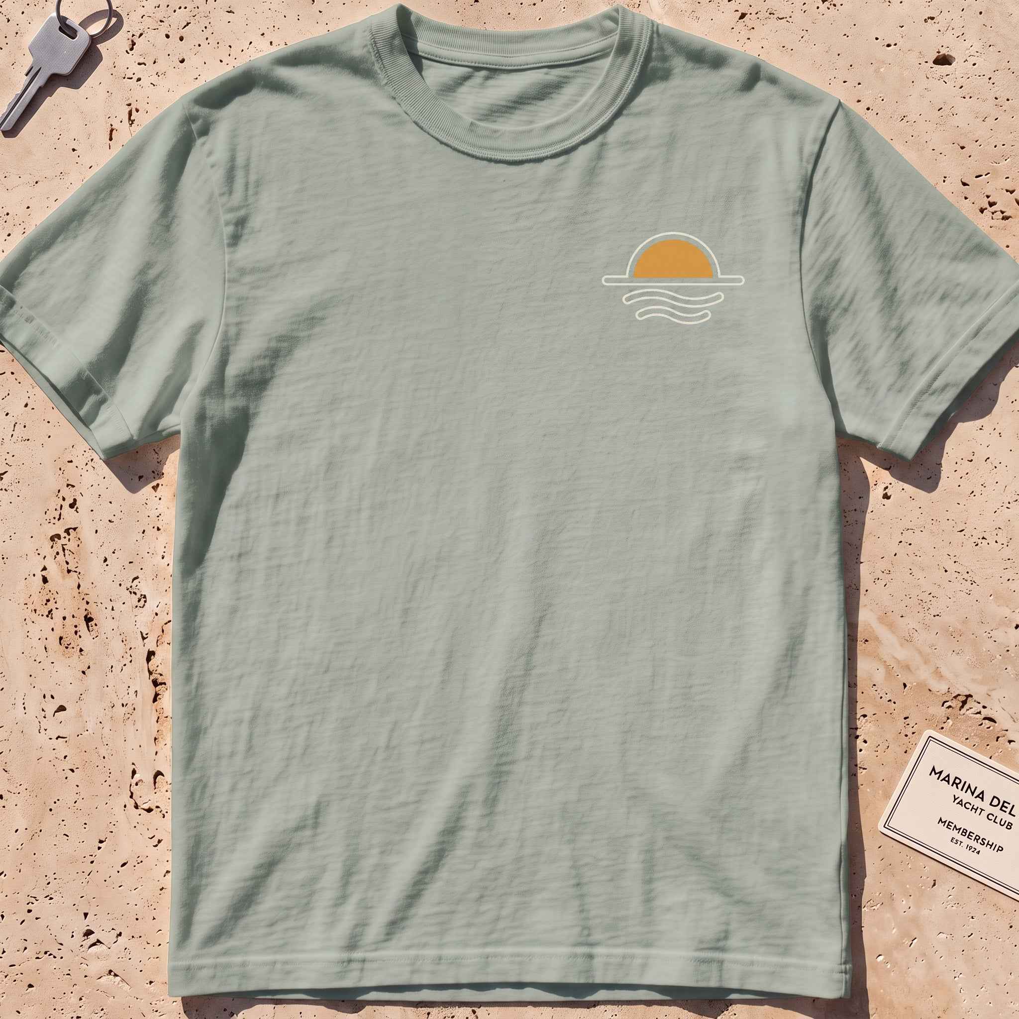bay heavyweight tee with a sun-and-waves crest graphic.