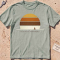 bay heavyweight tee with a striped sun disc and tiny sailboat graphic.