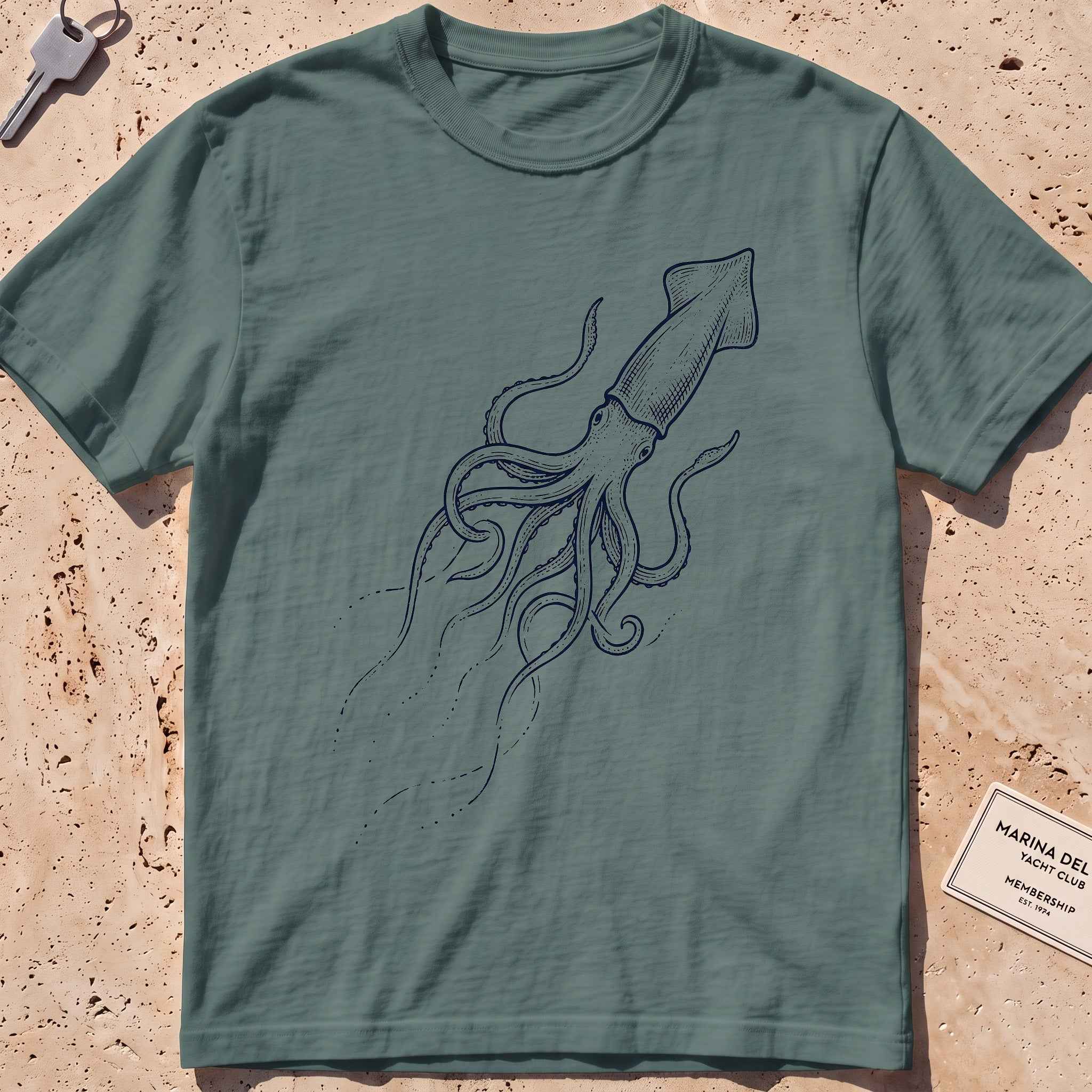 blue spruce heavyweight tee with an etched giant squid from the deep graphic.