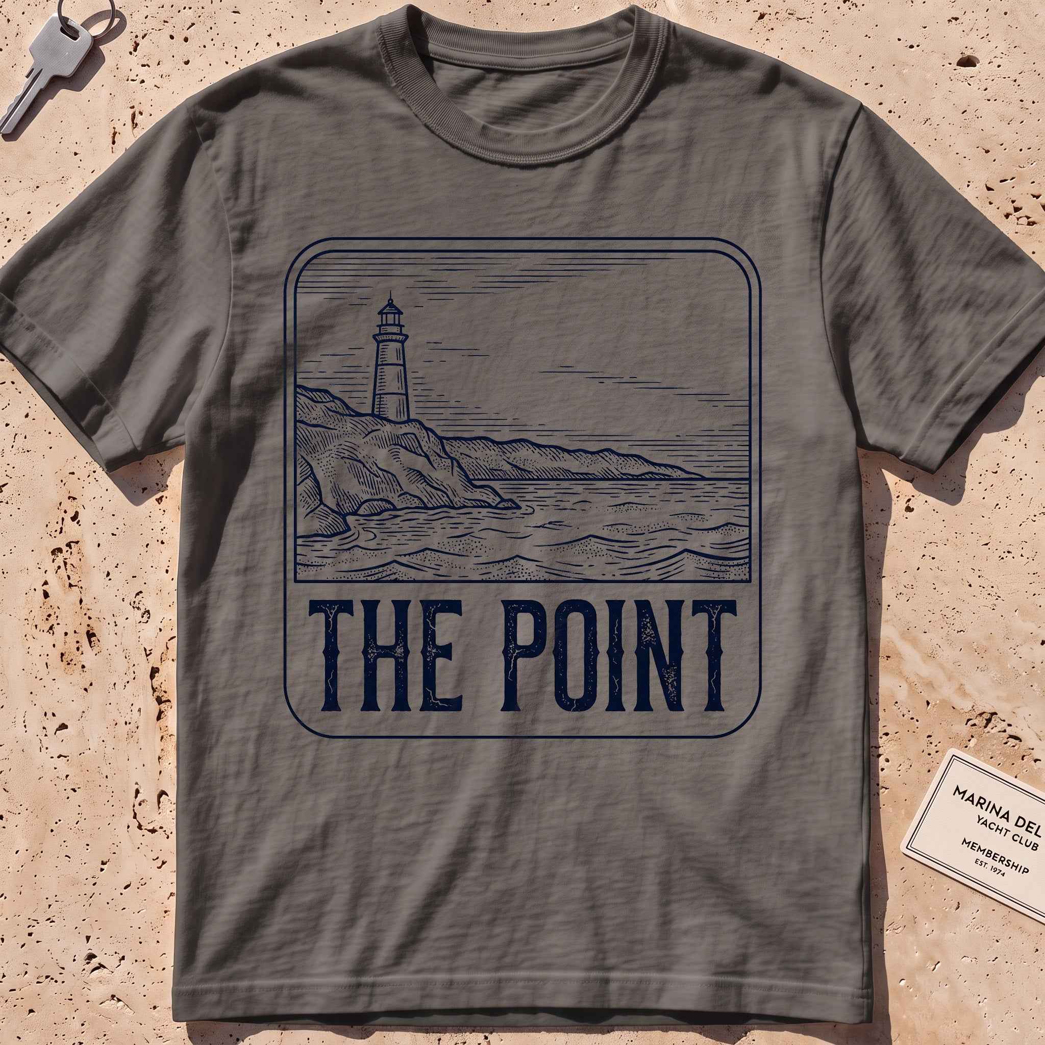 pepper heavyweight tee with an etched lighthouse point badge graphic.