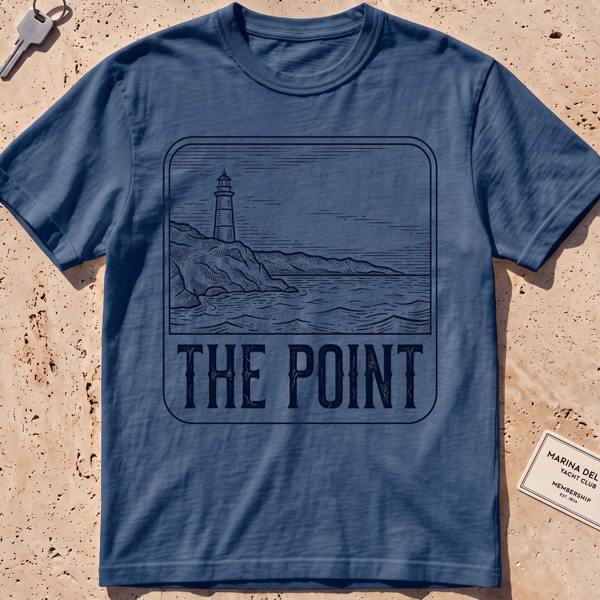 midnight heavyweight tee with an etched lighthouse point badge graphic.