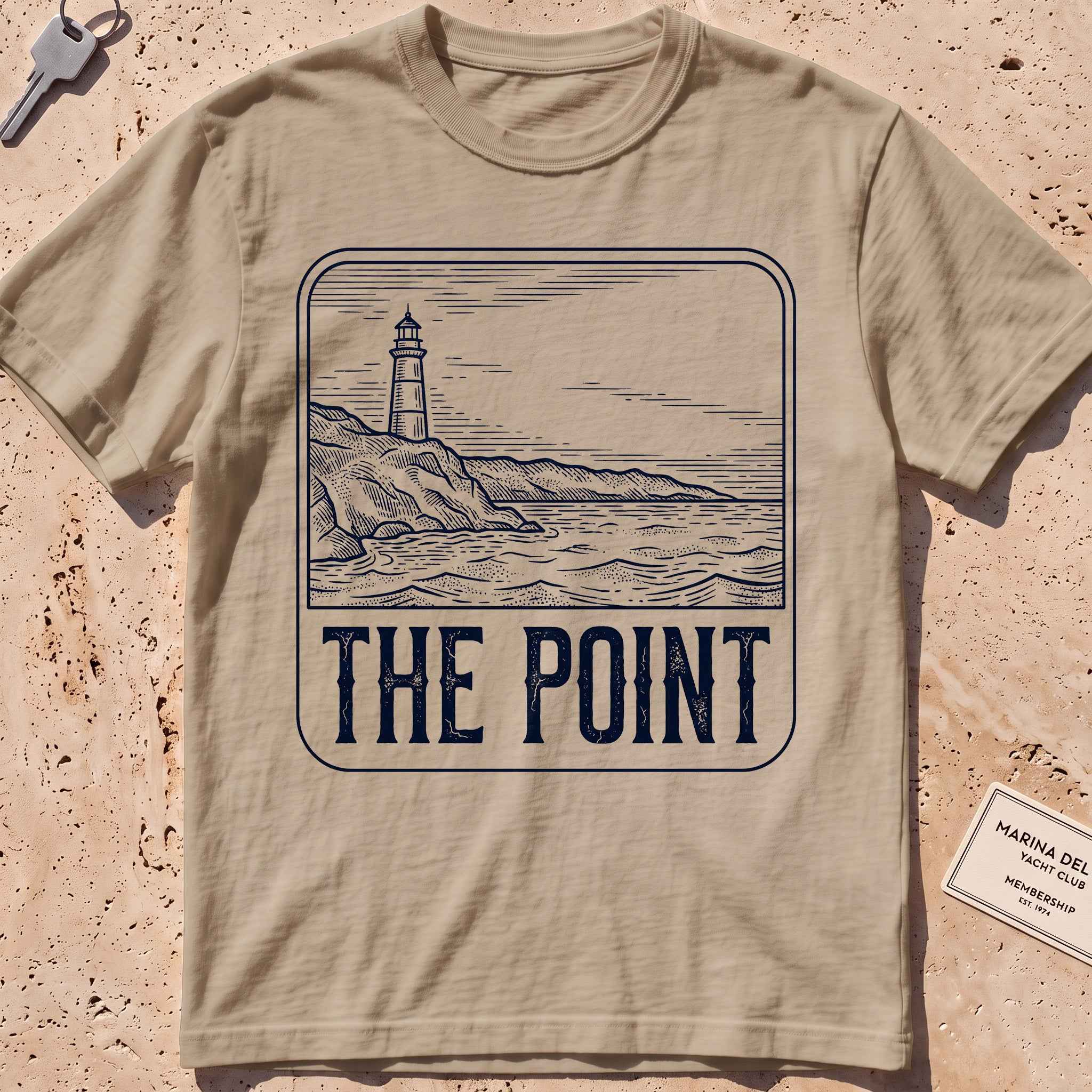 khaki heavyweight tee with an etched lighthouse point badge graphic.
