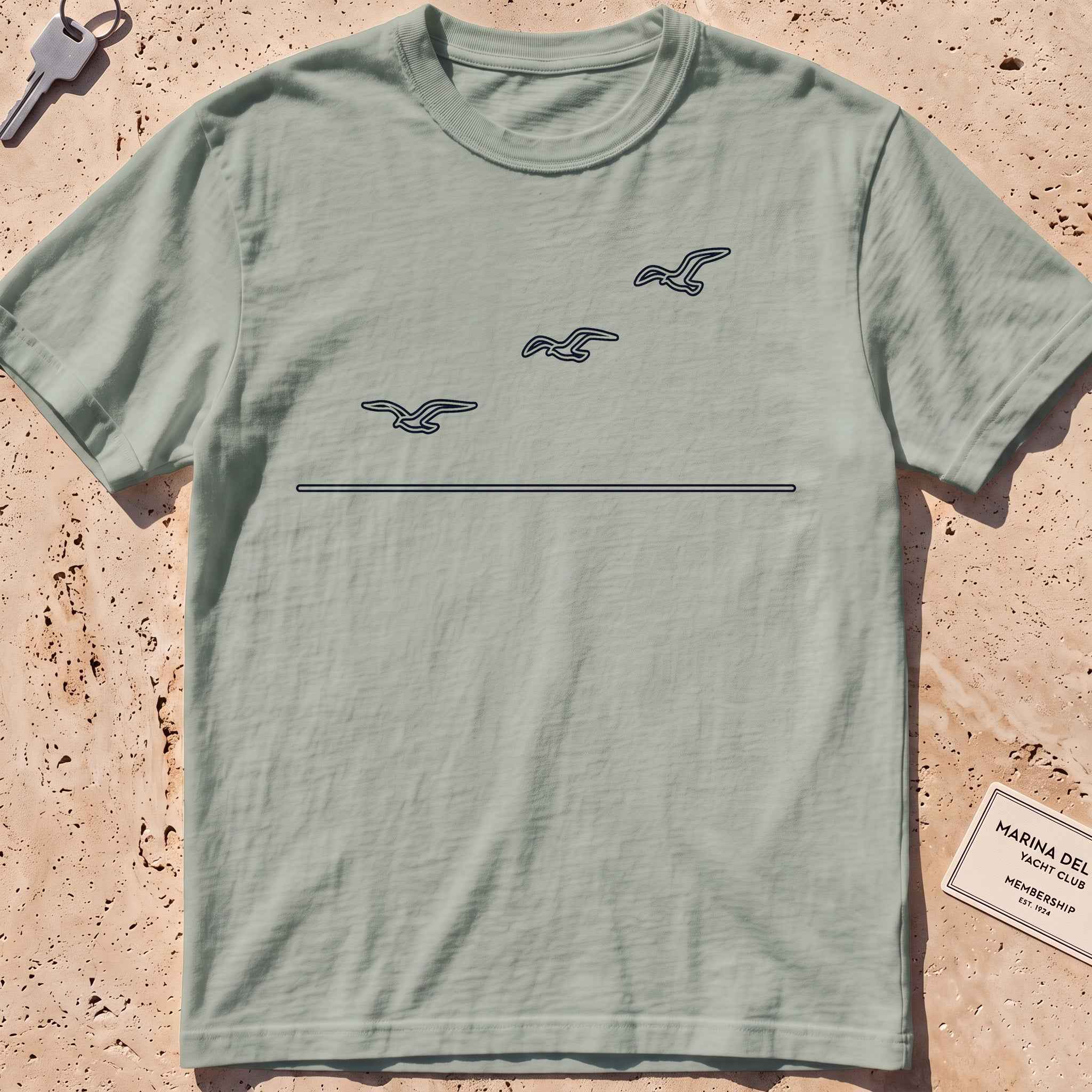 bay heavyweight tee with three single-line gulls in flight graphic.