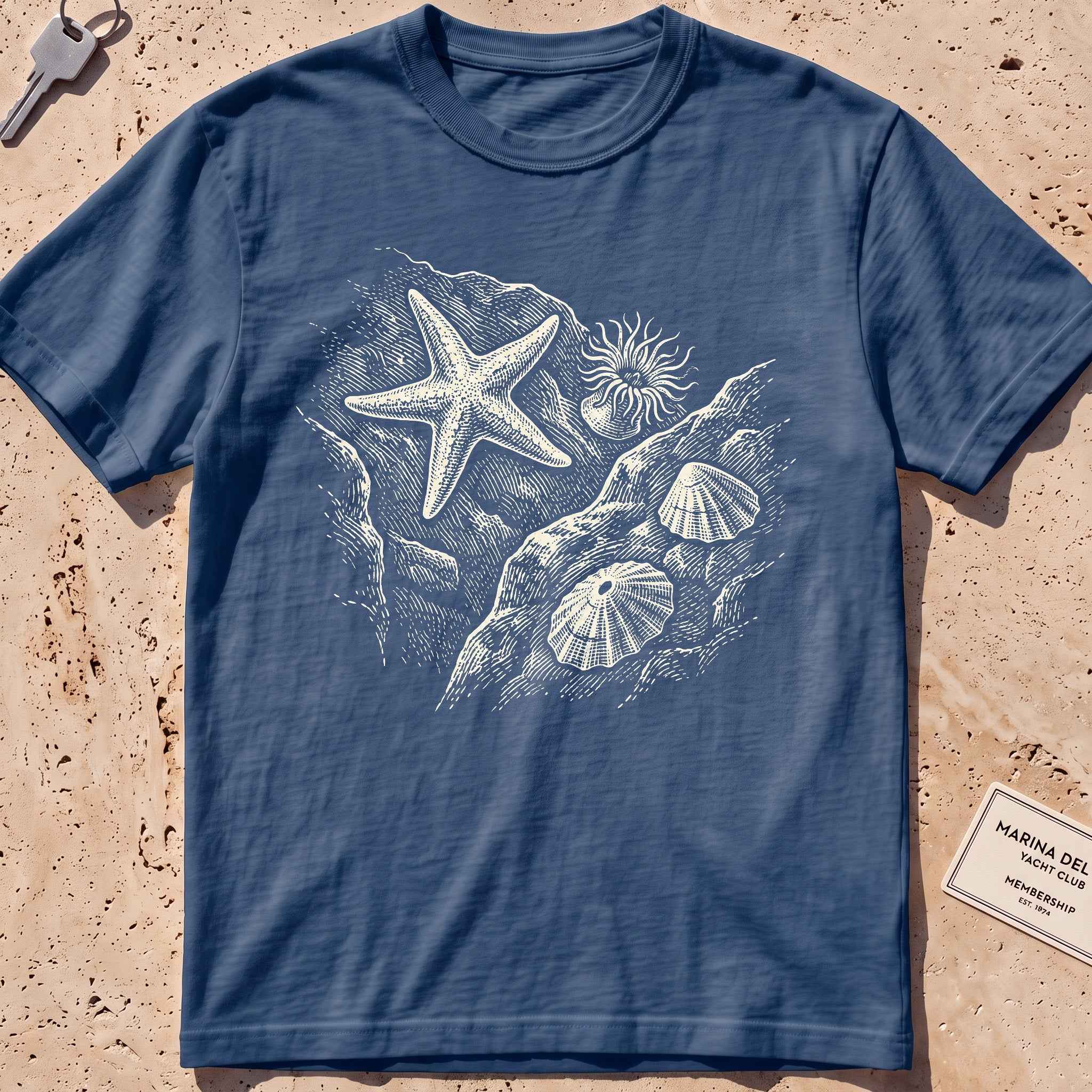 midnight heavyweight tee with an etched starfish and anemone tide pool graphic.