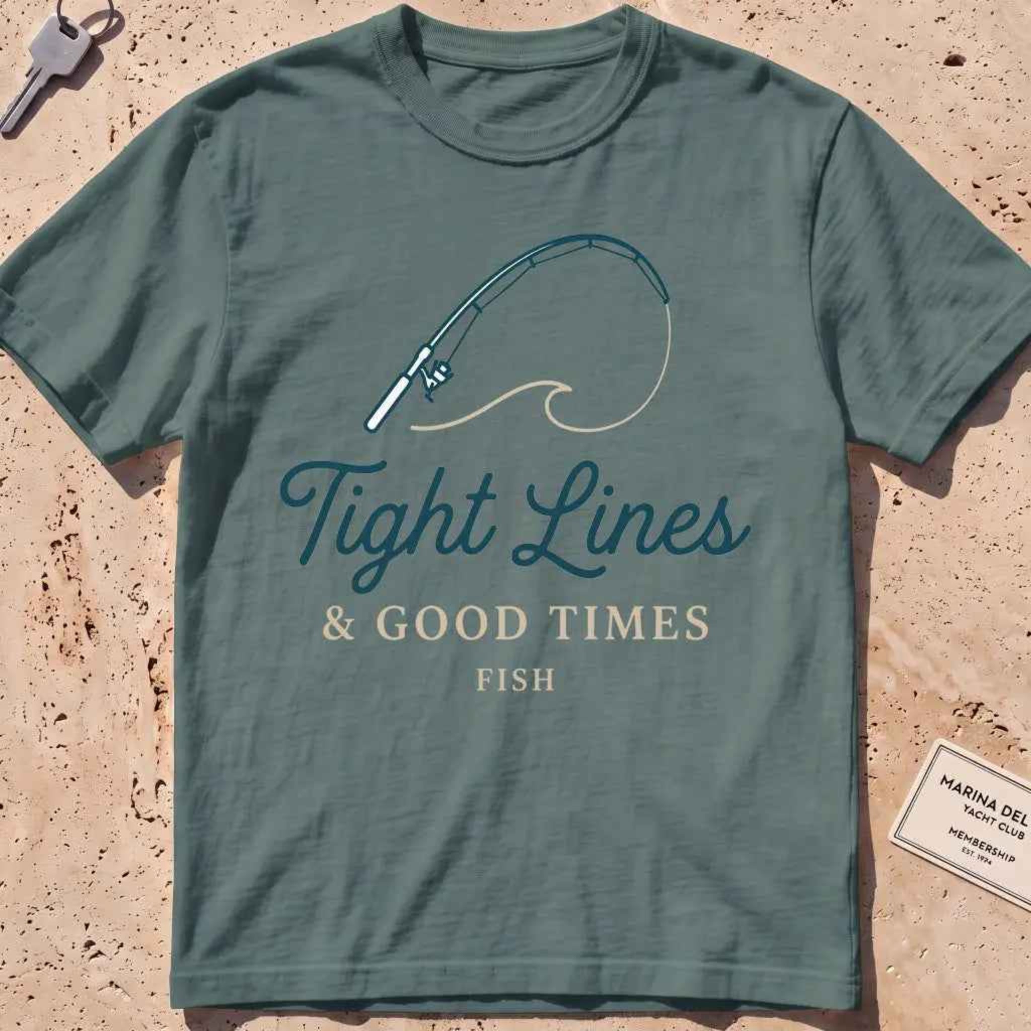 blue spruce heavyweight tee with a bent rod and "Tight Lines and Good Times" script.