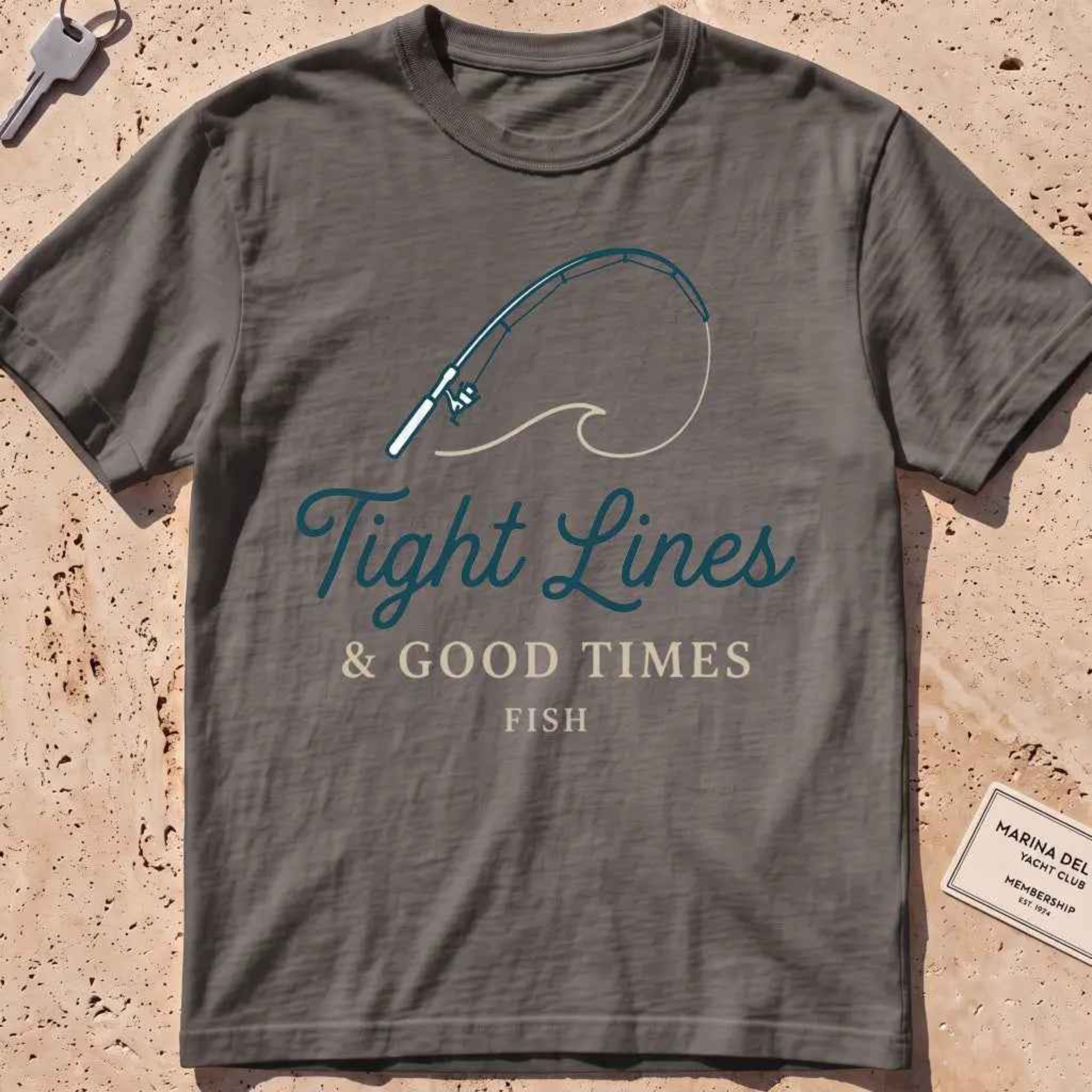 pepper heavyweight tee with a bent rod and "Tight Lines and Good Times" script.