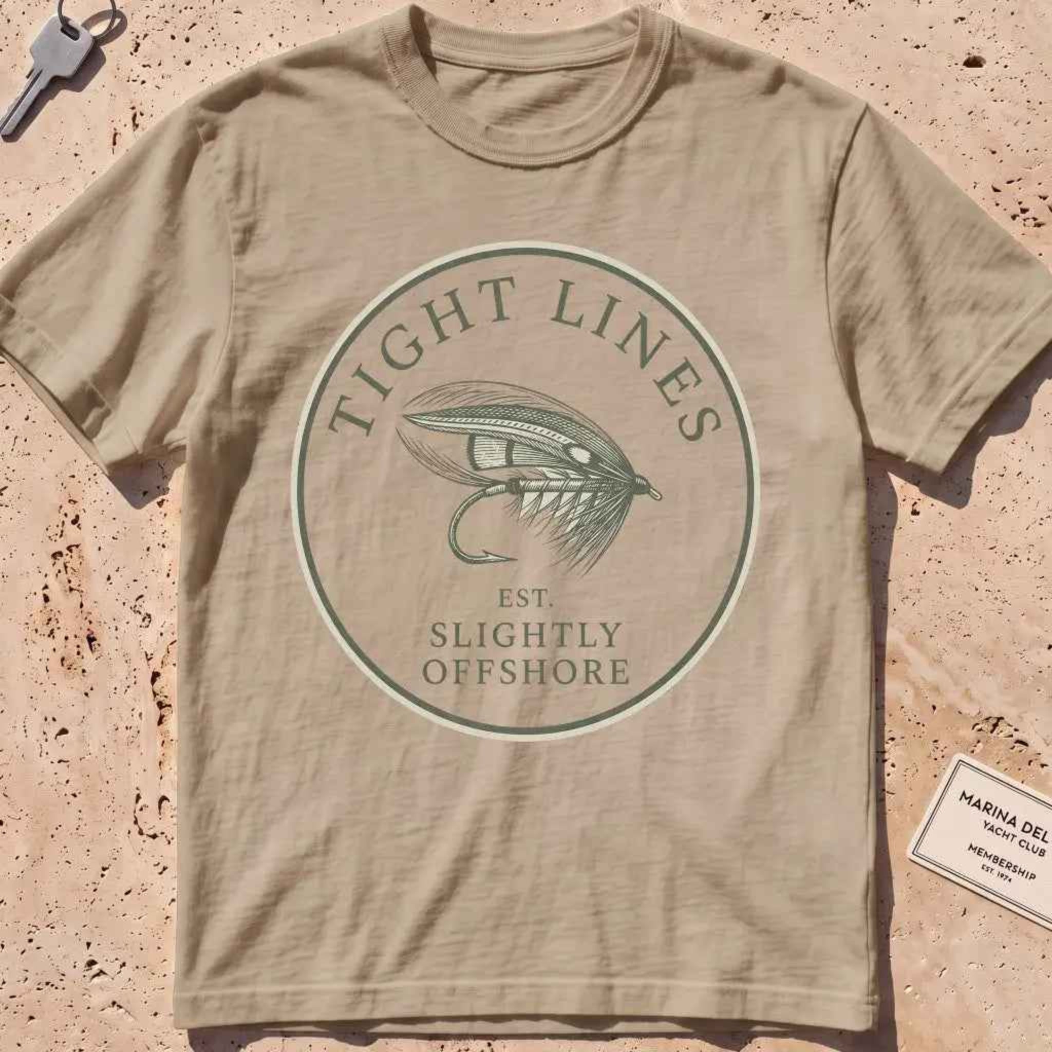 khaki heavyweight tee with an engraved "Tight Lines" fly-fishing crest.