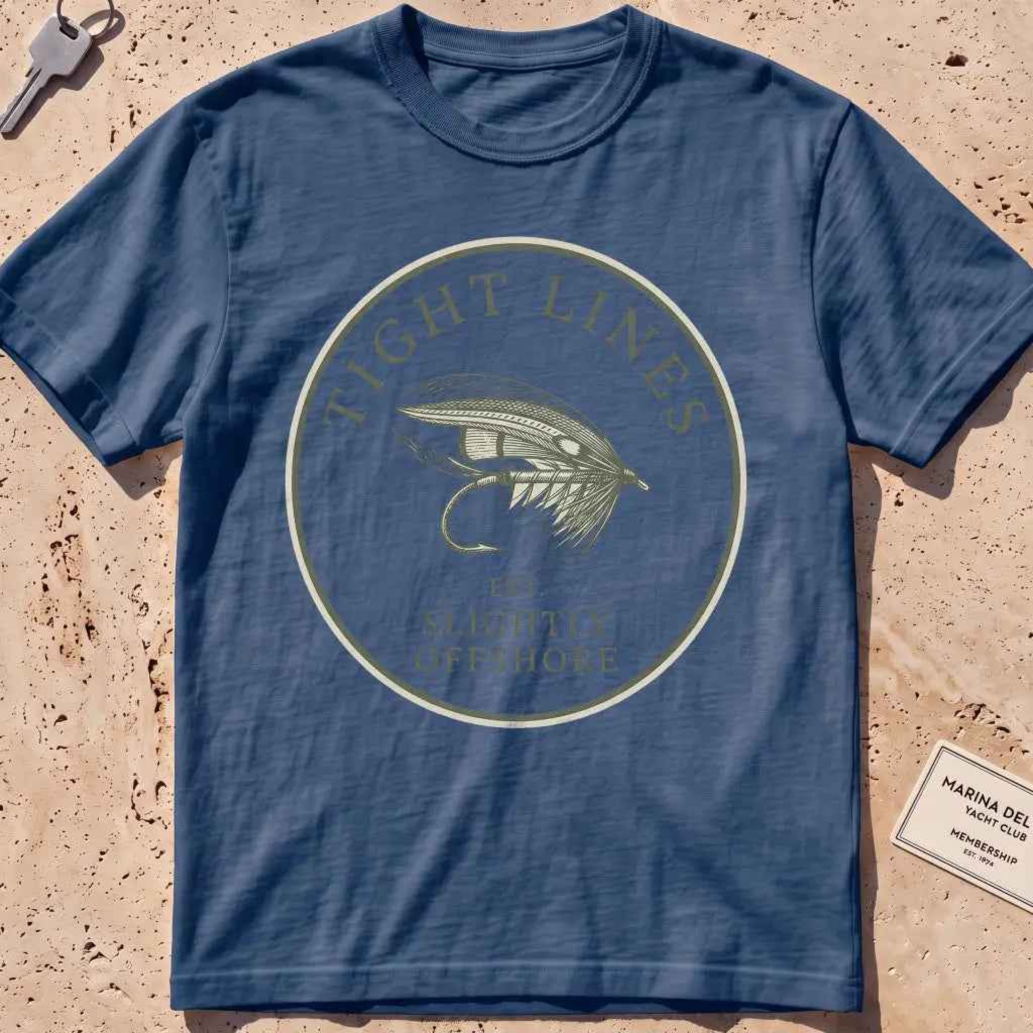 midnight heavyweight tee with an engraved "Tight Lines" fly-fishing crest.