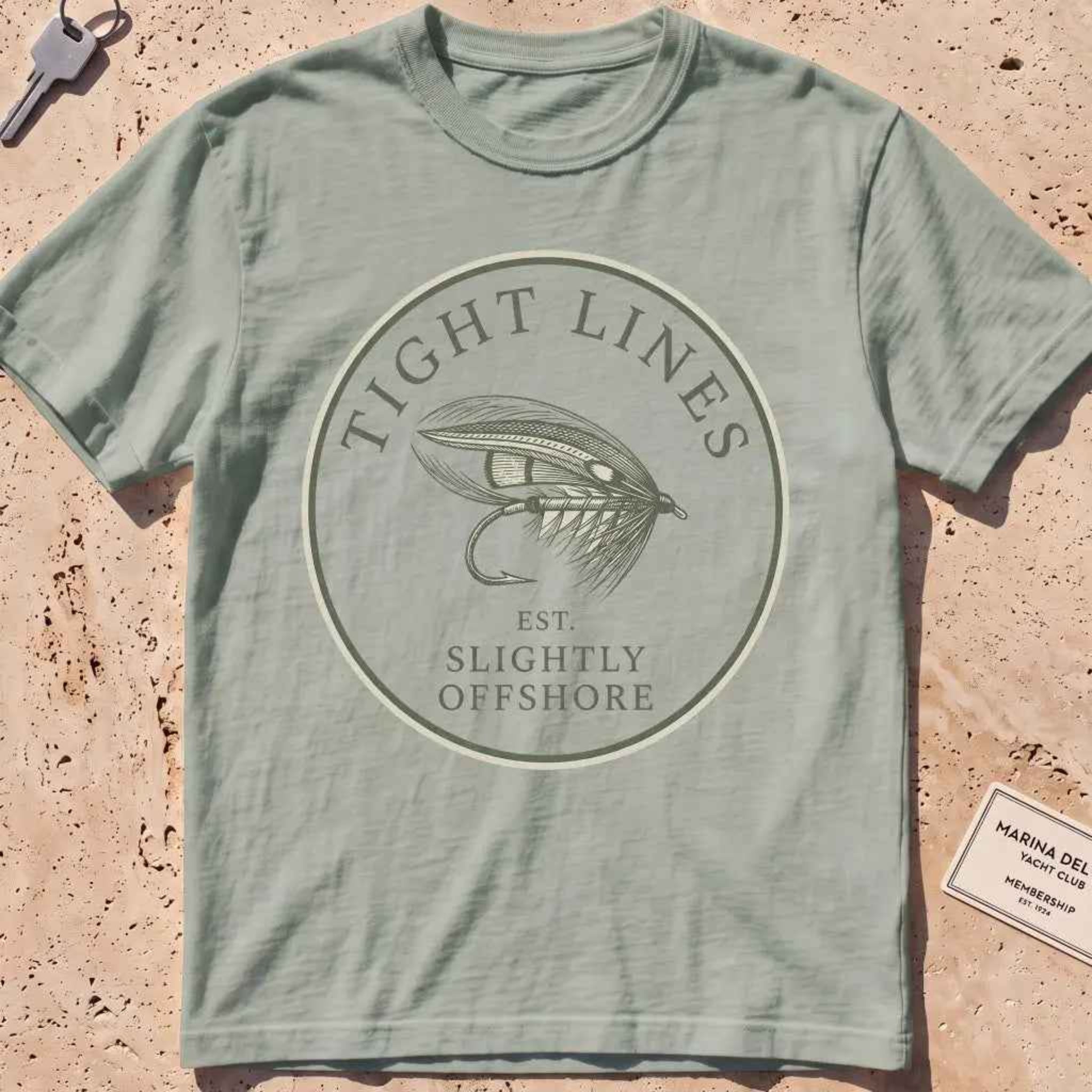 bay heavyweight tee with an engraved "Tight Lines" fly-fishing crest.