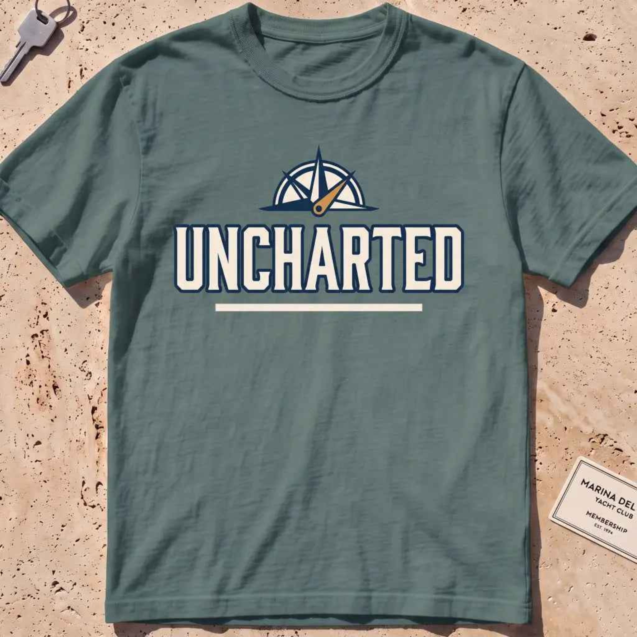 blue spruce heavyweight tee with a compass and bold "Uncharted" exploration type.