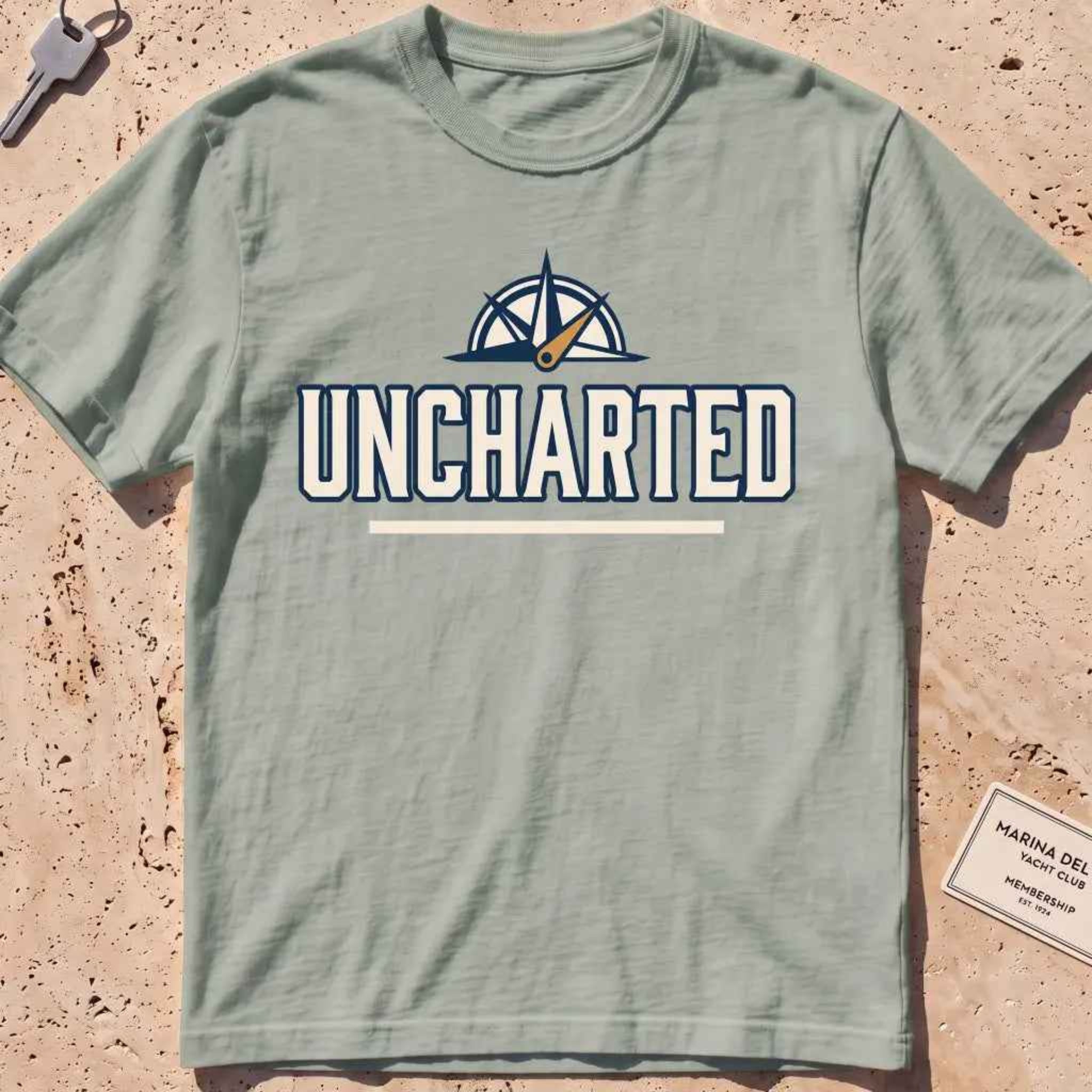 bay heavyweight tee with a compass and bold "Uncharted" exploration type.