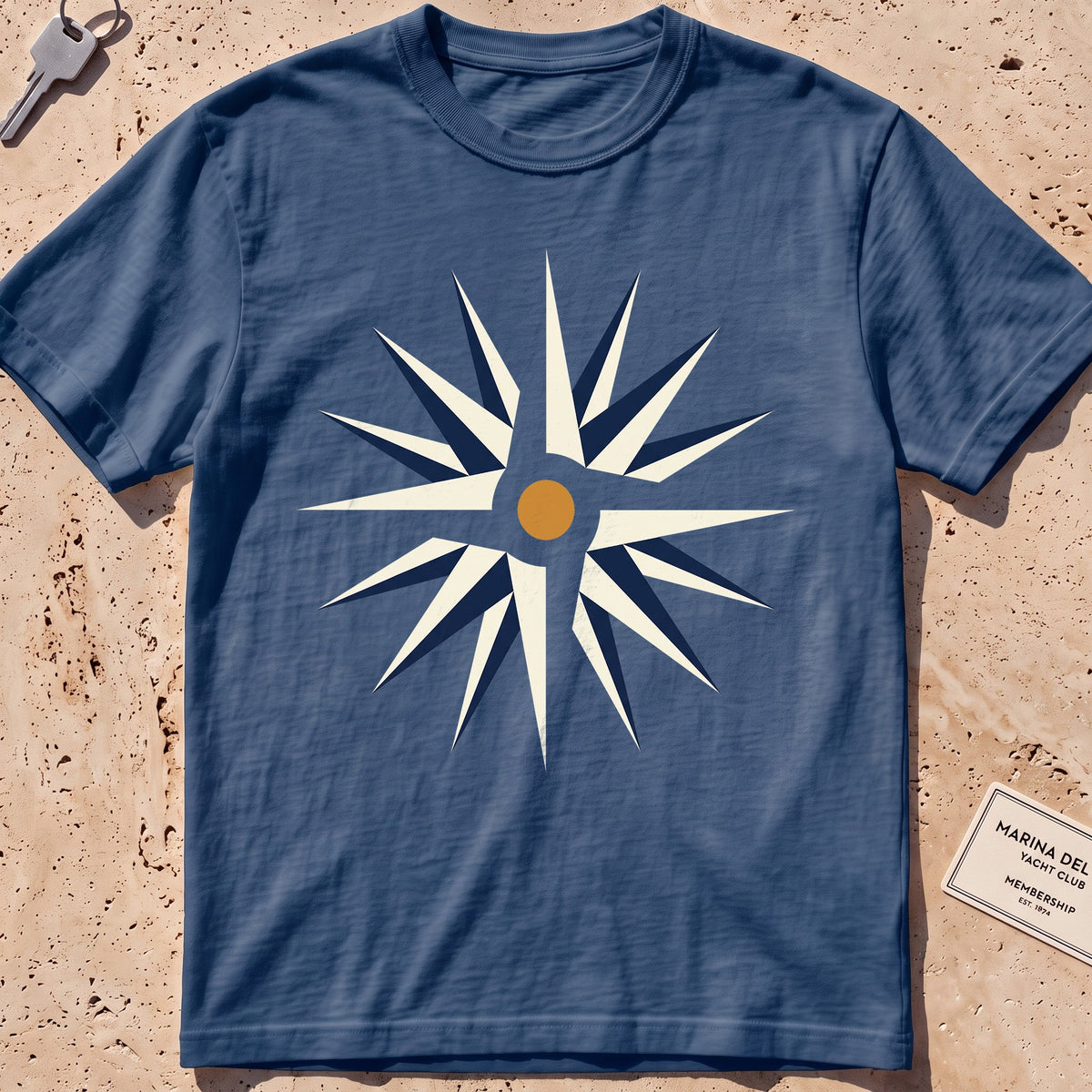 midnight heavyweight tee with a flat-geometric wind rose graphic.