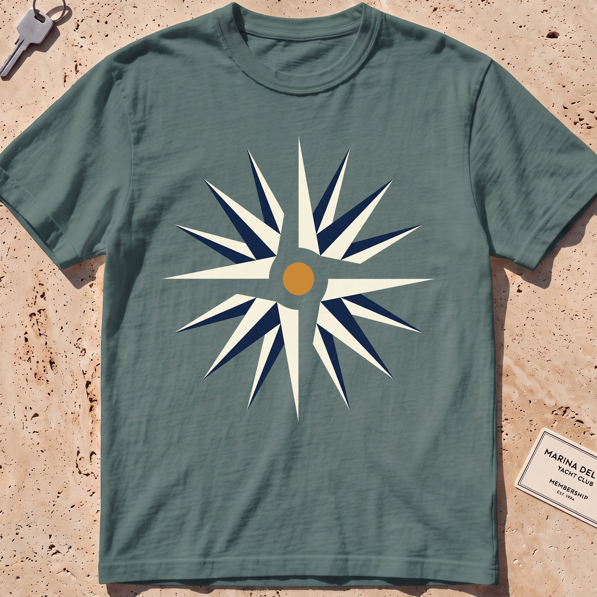 blue spruce heavyweight tee with a flat-geometric wind rose graphic.