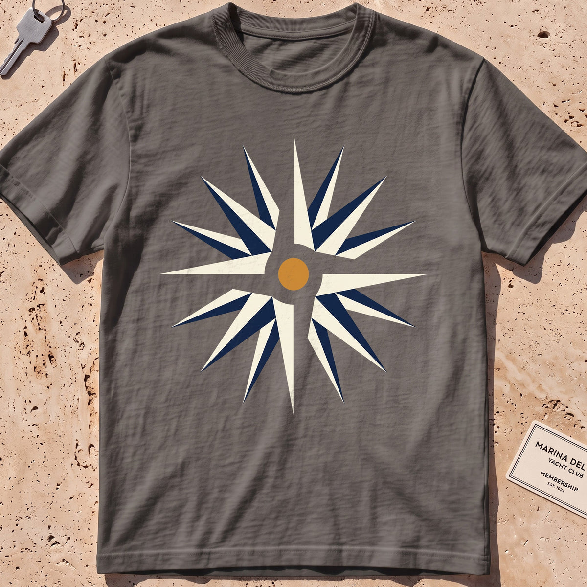 pepper heavyweight tee with a flat-geometric wind rose graphic.