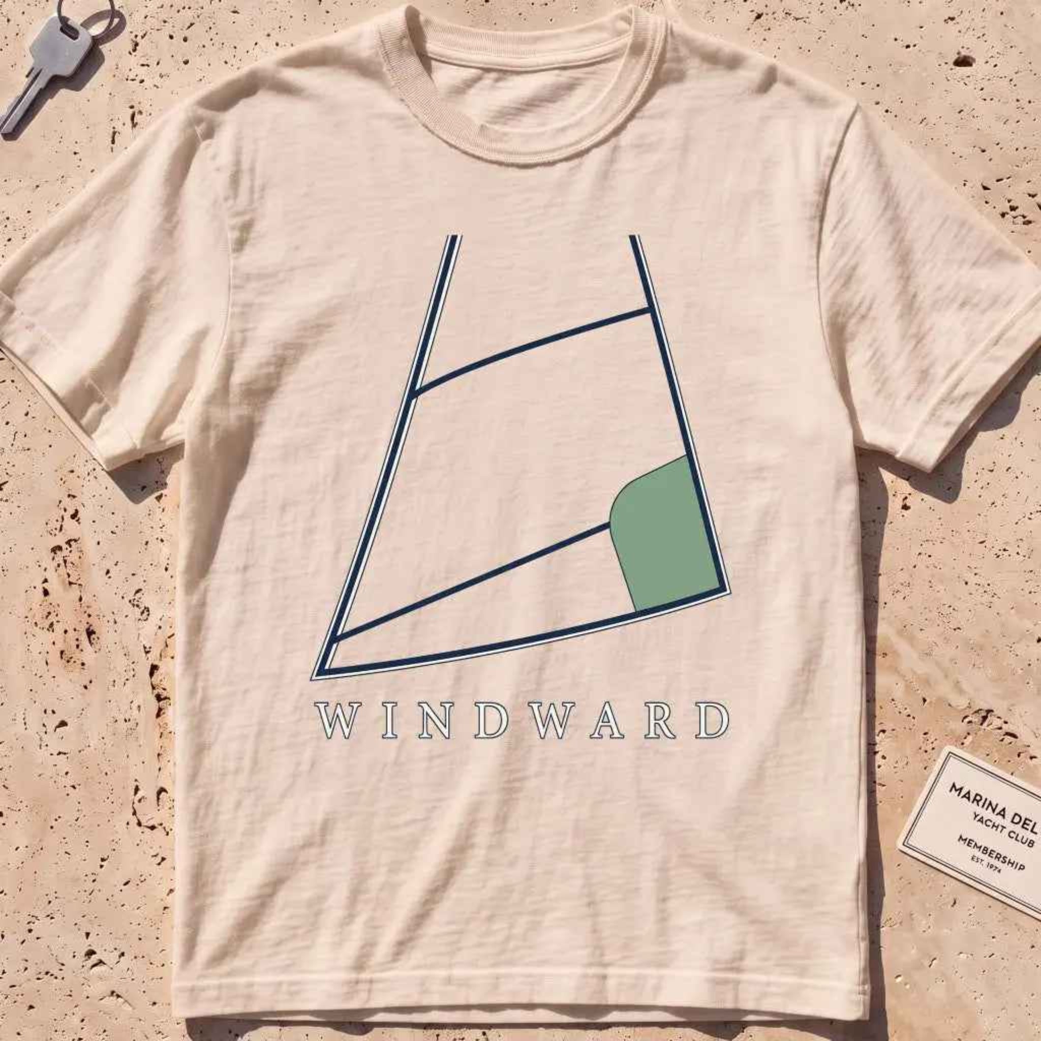 ivory heavyweight tee with a bold close-cropped mainsail filling the frame graphic.